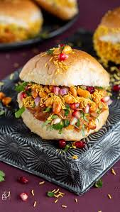 Mumbai-style pav slider loaded with crunchy sev, pomegranate, and fresh coriander